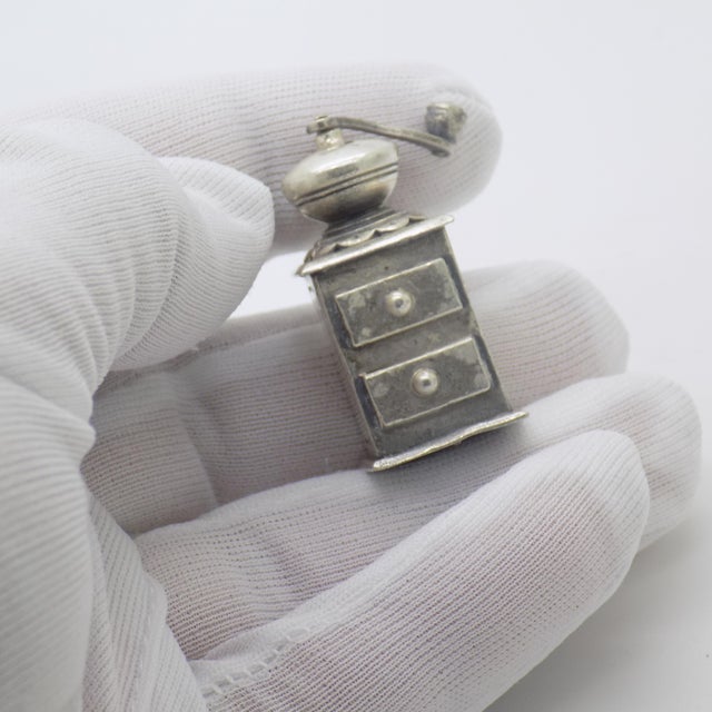 Crafted in Arezzo (AR), Tuscany, Italy during the 1970s/1980s, this vintage grinder miniature by Raspini is a refined...