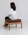 A charming French oak stool from the 1970s, featuring a solid wood base with softly rounded corners and turned legs. The...