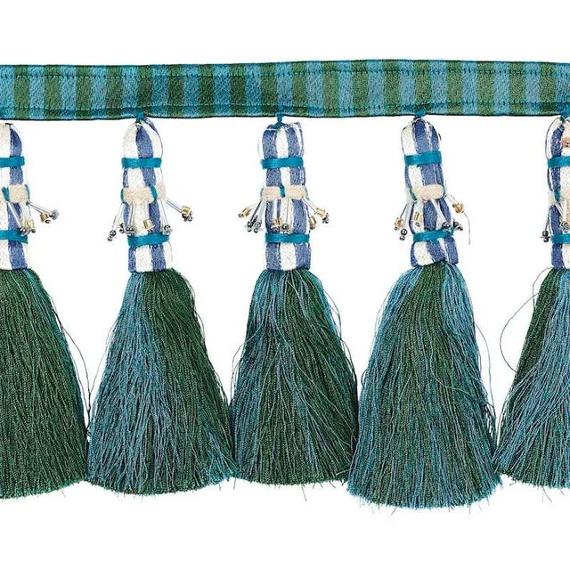A colorful, handcrafted trim that is totally over the top, this design incorporates silky, striped tassels and elegant...