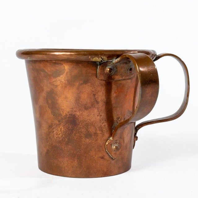 A unique antique copper two handled pass or wassail mug.