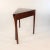 This is an elegant hand-crafted mahogany George III multifunctionality corner table. During this time, corner tables...
