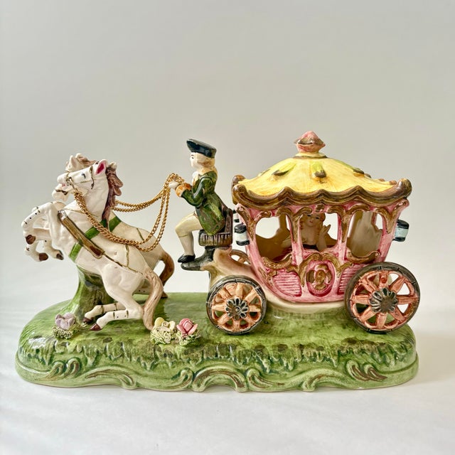 Vintage Enesco porcelain Cinderella carriage figurine in the Italian Capodimonte style. This whimsical decorative piece...