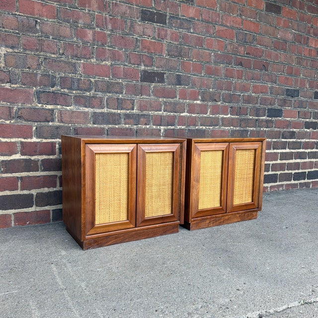 A beautiful pair of Mid-Century Modern nightstands from the highly sought-after Wonderwood collection by American of...