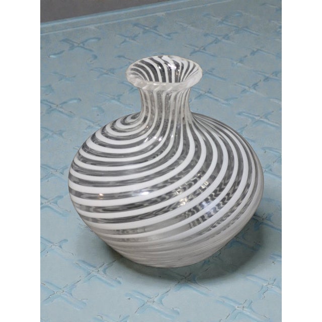 This vintage Italian art glass small bud vase features a white swirl pattern, attributed to Murano, Venice. Handmade with...