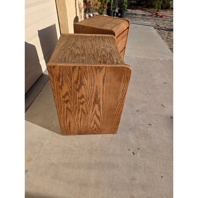Beautiful matching pair of vintage Arbek solid oak nightstands/end tables in great condition. Quality-made pieces with...