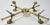 Antique 19th Century English style brass plated footed trivet or stand with round center plate cross for displaying a...
