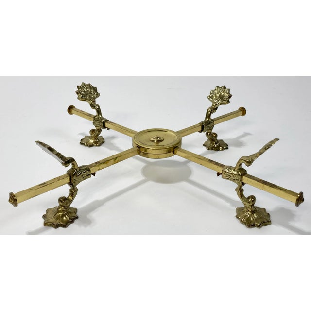 Antique 19th Century English style brass plated footed trivet or stand with round center plate cross for displaying a...