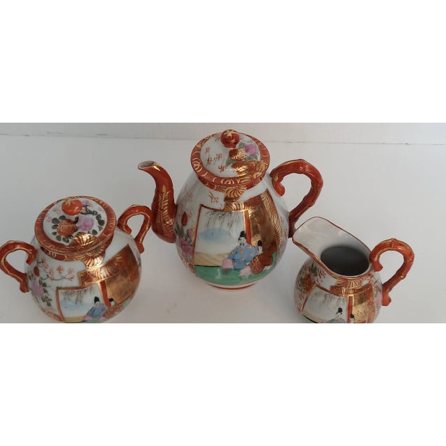 Lovely vintage tea set with seated male figures in ornately decorated garments with gold accents. Beautiful on shelf,...