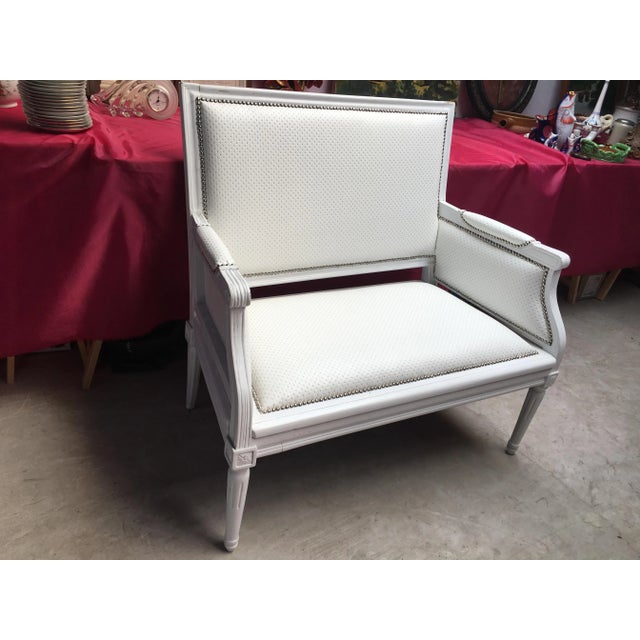 Small White two-seater sofa from around 1920. It is Louis XVI style, hand carved, Prosta. Re-upholstered with white...