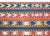 A bold and striking early 20th century Persian Jajim kilim rug composed of several alternating red and white, and blue and...