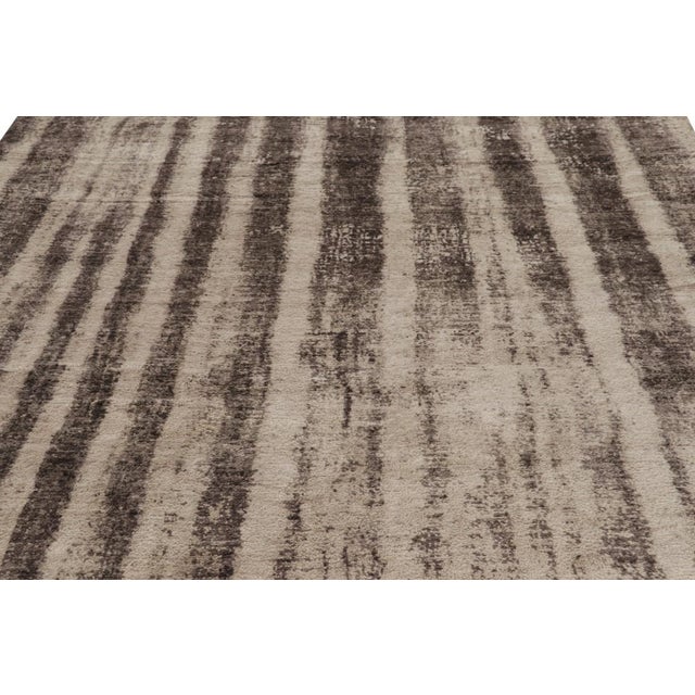 Made with hand-knotted wool, this 8x11 abstract rug is a rich new addition to Rug & Kilim’s Modern rug collection. On the...