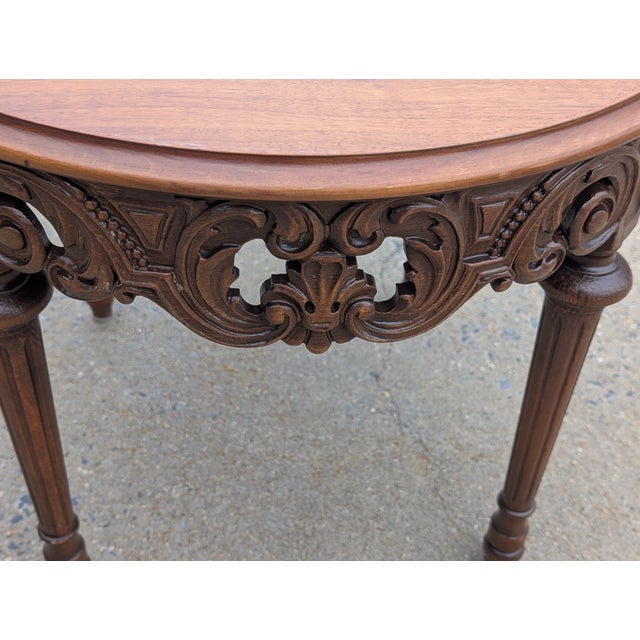 Recently refinished antique 1930s Italian Hand Carved Walnut Center Lamp Table, an exquisite example of Renaissance...