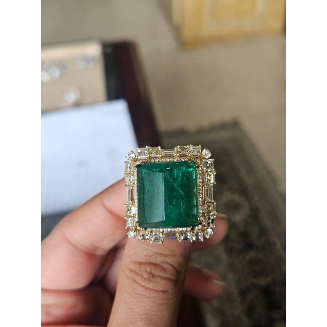 very gorgeous and beautiful, Emerald Cocktail Ring set in 18K Yellow Gold & natural Diamonds. The weight of the Emerald...