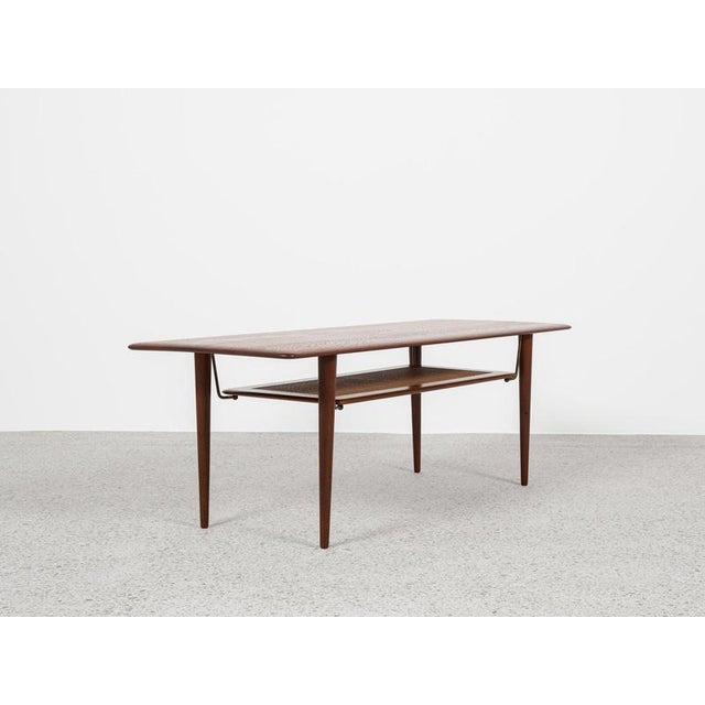 This rectangular coffee table with 2 levels is designed by Peter Hvidt & Orla Mølgaard-Nielsen and manufactured by France...