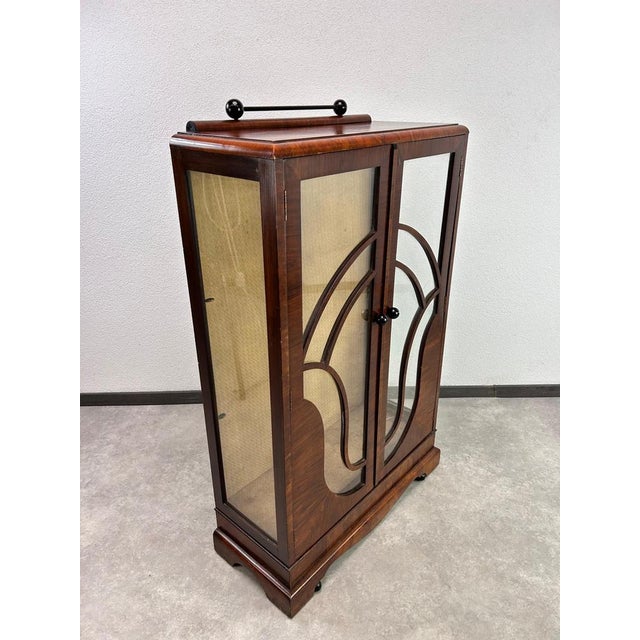 Small walnut art deco display cabinet in original vintage condition with signs of use.