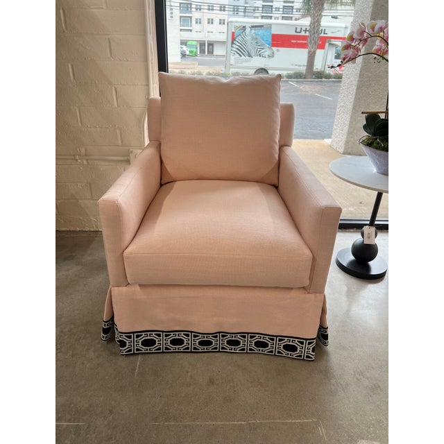 Graceful and inviting, this custom swivel chair brings a perfect blend of softness and statement design. Upholstered in a...