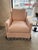 Graceful and inviting, this custom swivel chair brings a perfect blend of softness and statement design. Upholstered in a...