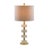 This table lamp features a series of white acrylic components, paired with a brass frame and a round base, creating a...