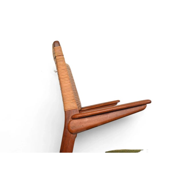 Origin: Denmark Designer: E Knudsen Manufacturer: Jensen & Lykkegaard Era: 1950s Materials: Teak, Cane Measurements: 22.5"...