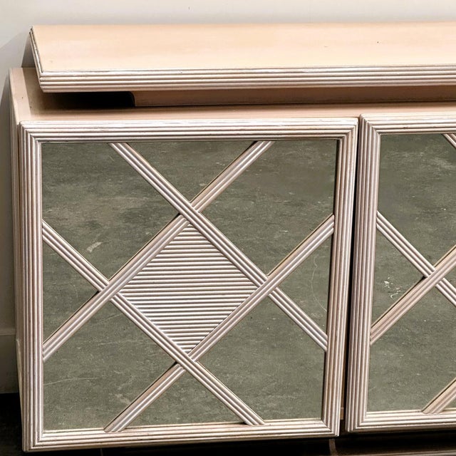 178 cm wide × 49 cm deep × 80 cm high A highly decorative 1980s Roche Bobois sideboard finished in a very soft, powder-...