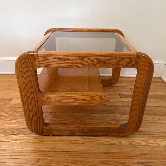 1970s Mid-Century Modern Lou Hodges oak side table. Classic California modern design with curved lines, smoked glass...
