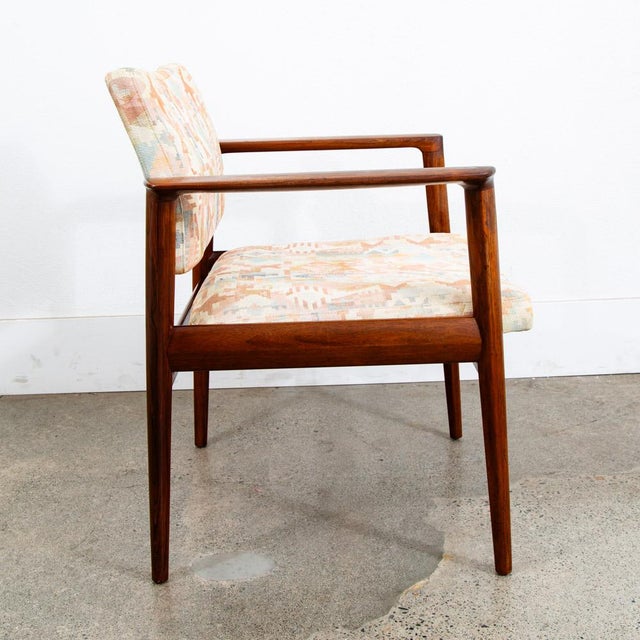 Danish armchair in rosewood in the style of Finn Juhl. Abstract fabric throughout with some minimal wear. Overall very...