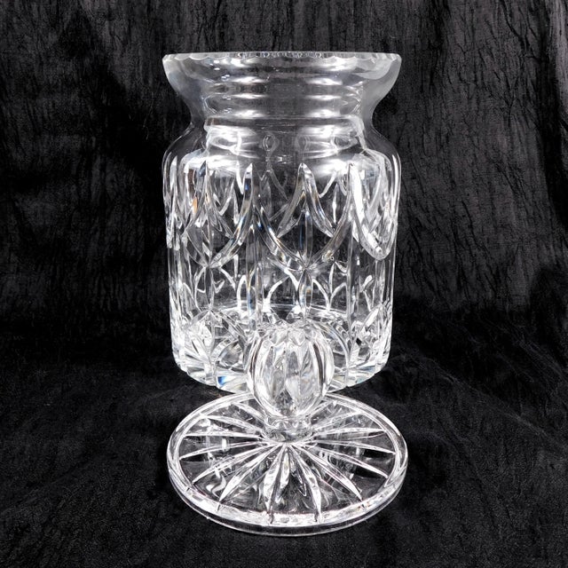 This is a large and heavy cut crystal biscuit jar with an odd detail. The inside lip to the biscuit jar is curved rather...