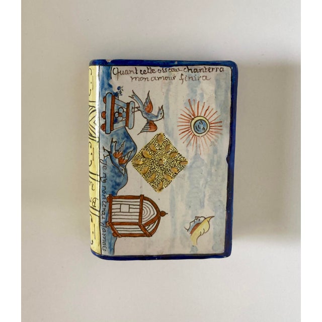 This charming antique French Nevers faience hand warmer/snuff bottle or secouette/perfume in book form dates from the late...