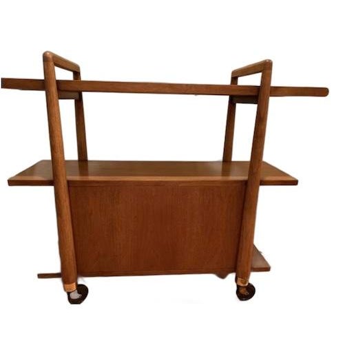 Mid-Century Modern three-tier rolling bar cart, manufactured by the Drexel Furniture as part of their highly collectible...