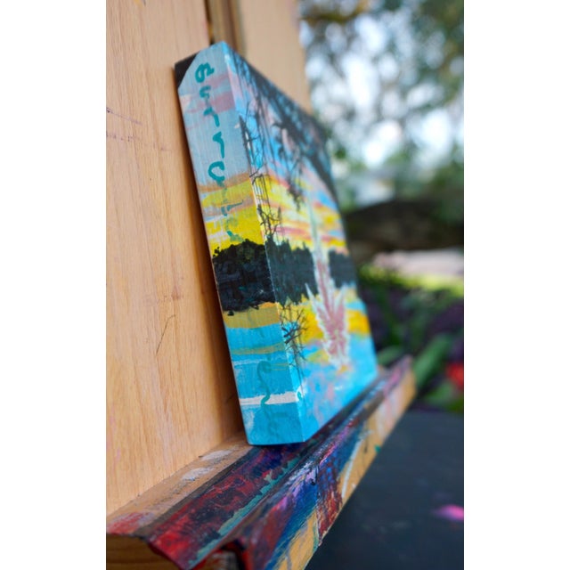 This artwork features a vibrant depiction of a lake scene in Cherokee, Florida, where a striking leaf motif emerges...