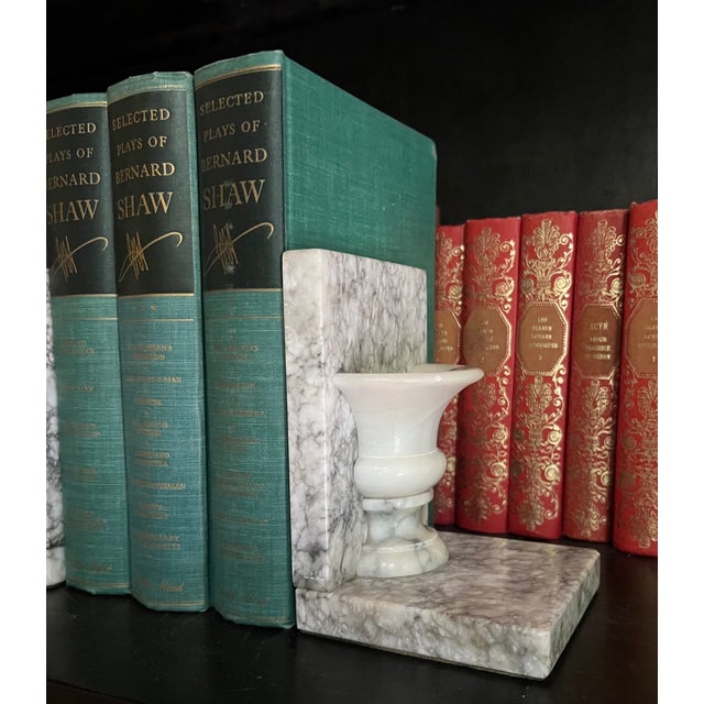 Vintage marble made in Italy in the mid century, each has a half vessel attached also in marble.