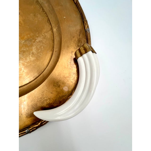 Plastic Vintage Italian Hollywood Regency Oval Statement Size Brass Tray With Faux Boar Tusk Handles and Cross Strap Trim For Sale - Image 7 of 16