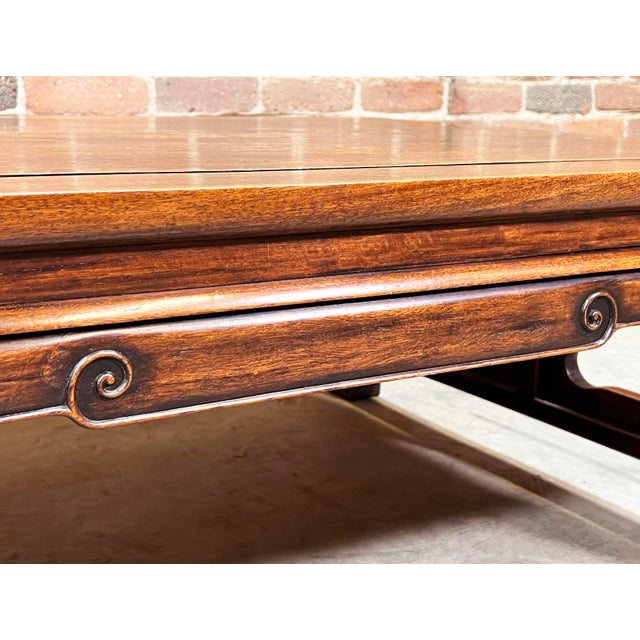 This exquisite c.1930's Hong Kong-made coffee table is crafted from solid Burma Padauk wood, known for its rich, warm...