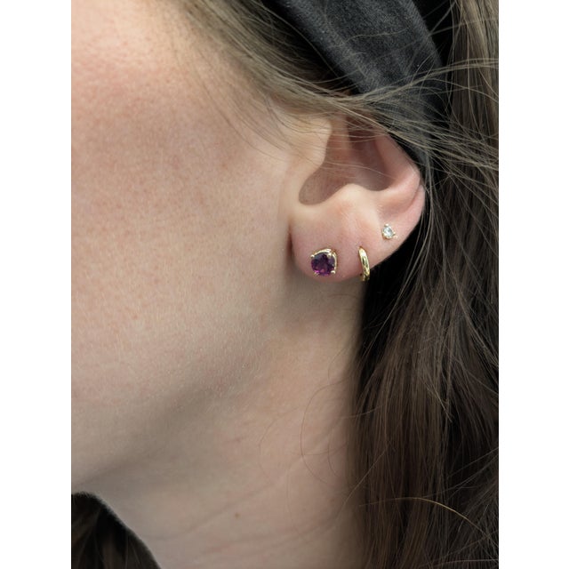 These round 4mm Solitaire studs feature natural rhodolite garnets from Madagascar (1.22 carat total), set in solid 14K...