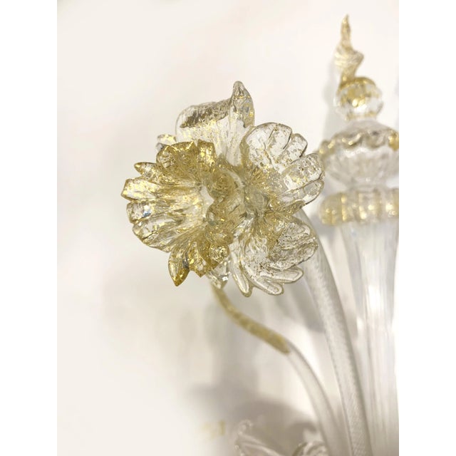 Classical Transparent Ca' Rezzonico Murano glass wall sconce. "Ca Rezzonico" working of arms and floreal elements pinced...