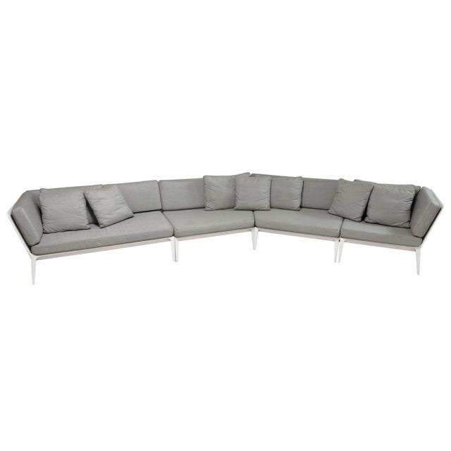 The Richard Frinier for Brown Jordan Still Collection Angled Outdoor Sofa is a sophisticated modular seating piece...