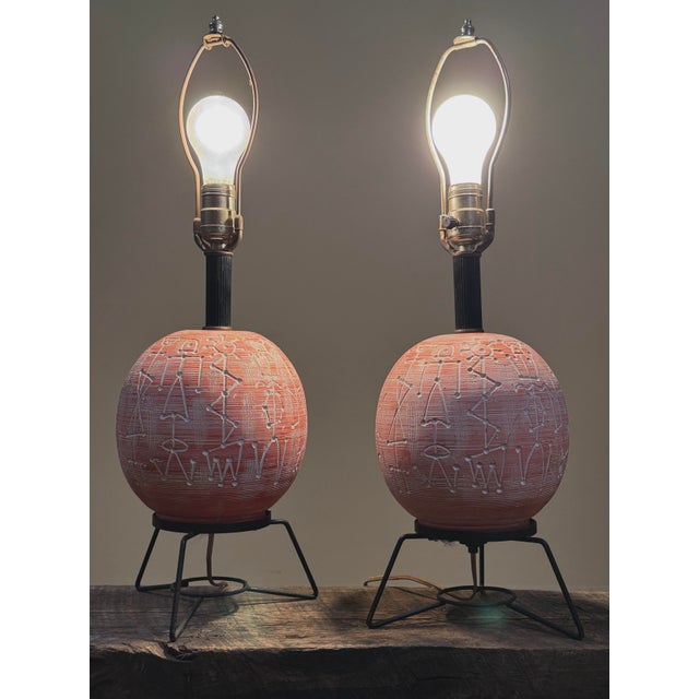 Pair of Modernist Vintage Carved Pink Ceramic Lamps on Black Wire Stands Date / Period: Vintage, mid-20th century...