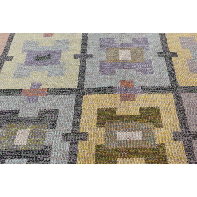 Vintage Swedish Flat Weave rug by Agda Osterberg Size: 6'5" × 10'0" (195 × 304 cm) ​The vintage Swedish flat-weave rug by...