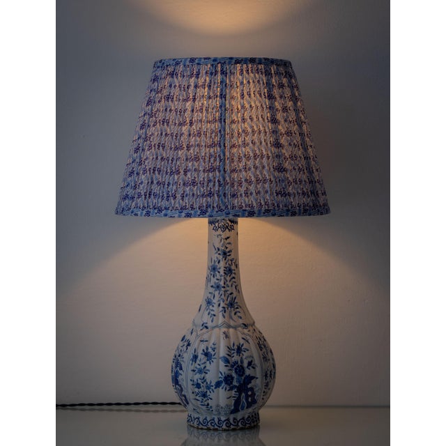 An antique french blue and white faience table lamp by samson of paris, circa 1880–1910, featuring intricate hand-painted...