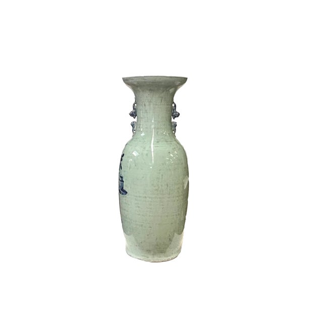 This Chinese porcelain tall vase exudes elegance and charm with its distressed pale light green hue, adding a touch of...