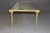 This elegant Maison Baguès églomisé glass coffee table is a superb example of twentieth-century French luxury design,...