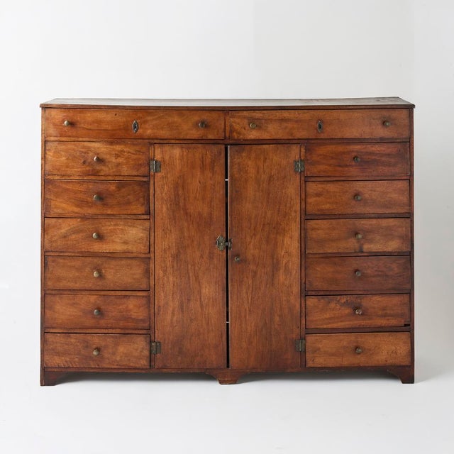 - One of our most special discoveries, this antique French cabinet is made entirely from walnut with aged brass fittings....