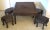 Antique Chinese Hand Carved Rosewood Square Folding Game Table and Stools 5 Piece Set The table top is carved with a...