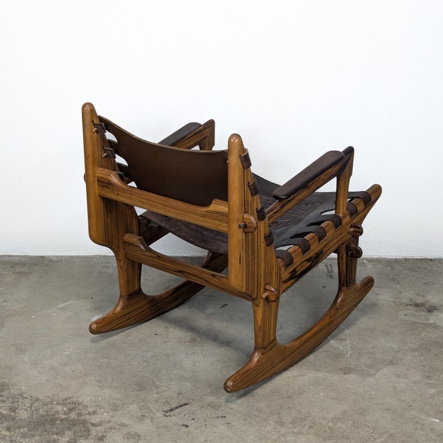 Introducing a stunning Mid Century Modern Leather & Rosewood Rocking Chair by the renowned designer Angel Pazmino, dating...