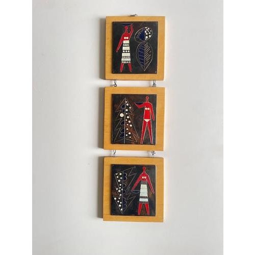 This striking three-panel vintage enamel wall artwork features stylized human figures and abstract, organic forms rendered...