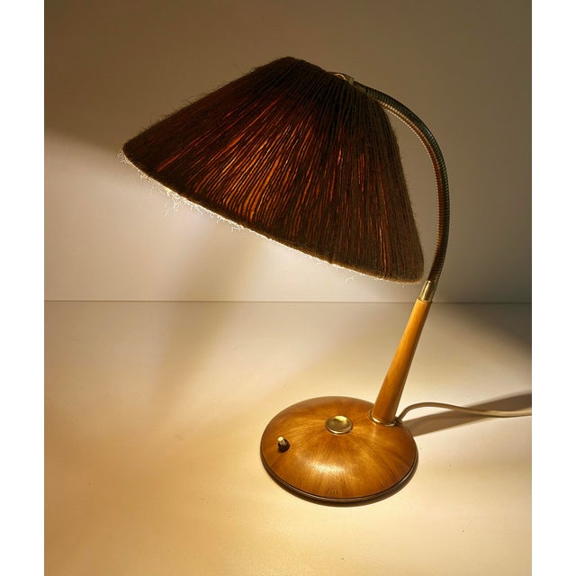 Vintage desk lamp featuring a sisal shade mounted on a brass flex stem, teak futteral and base with star shaped veneer...
