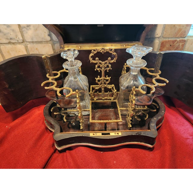 Napoleon III style blackened pearwood liquor cabinet rich brass ornamentation with vine motif rare violin shape very...