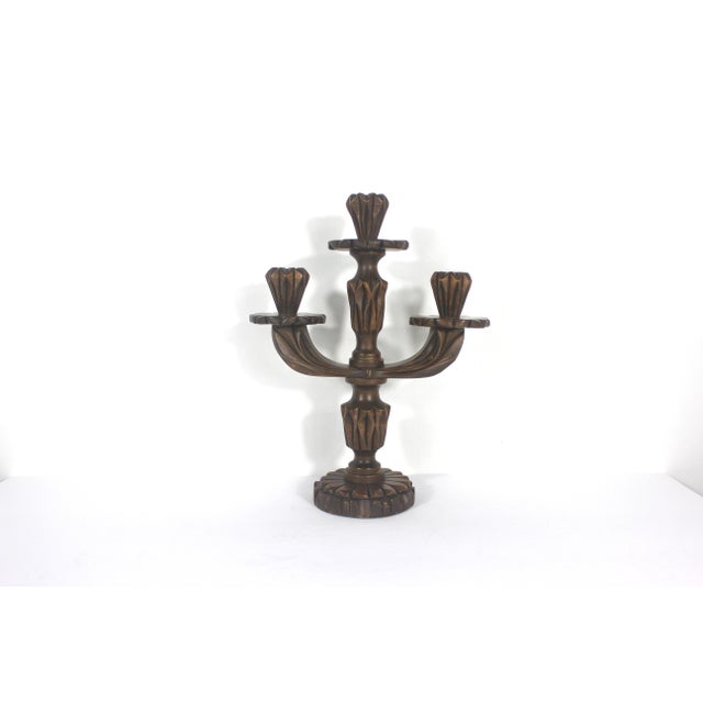Mid century hand carved wood candelabra with three arms. Signed by the artist on the bottom.