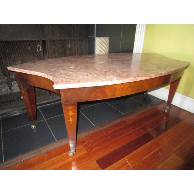 The novel shape and color of this Breccia marble coffee table will turn heads and transform a living or work space. This...