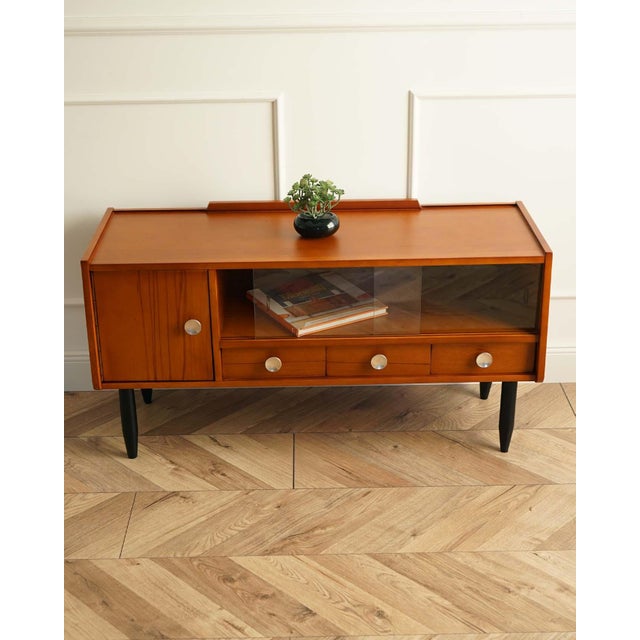 This unique Mid-Century Modern style TV unit was made in Vilnius, Lithuania 1965s. The surface is covered with natural...